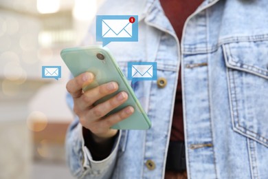 Image of Email. Woman using mobile phone outdoors, closeup. Letter illustrations near device