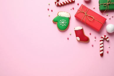 Photo of Flat lay composition with Christmas decorations on pink background, space for text