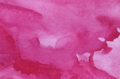 Abstract pink watercolor painting as background, top view