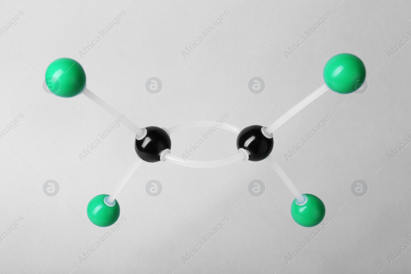 Photo of Molecular atom model on light grey background. Chemical structure