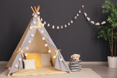 Photo of Cozy child's room interior with play tent