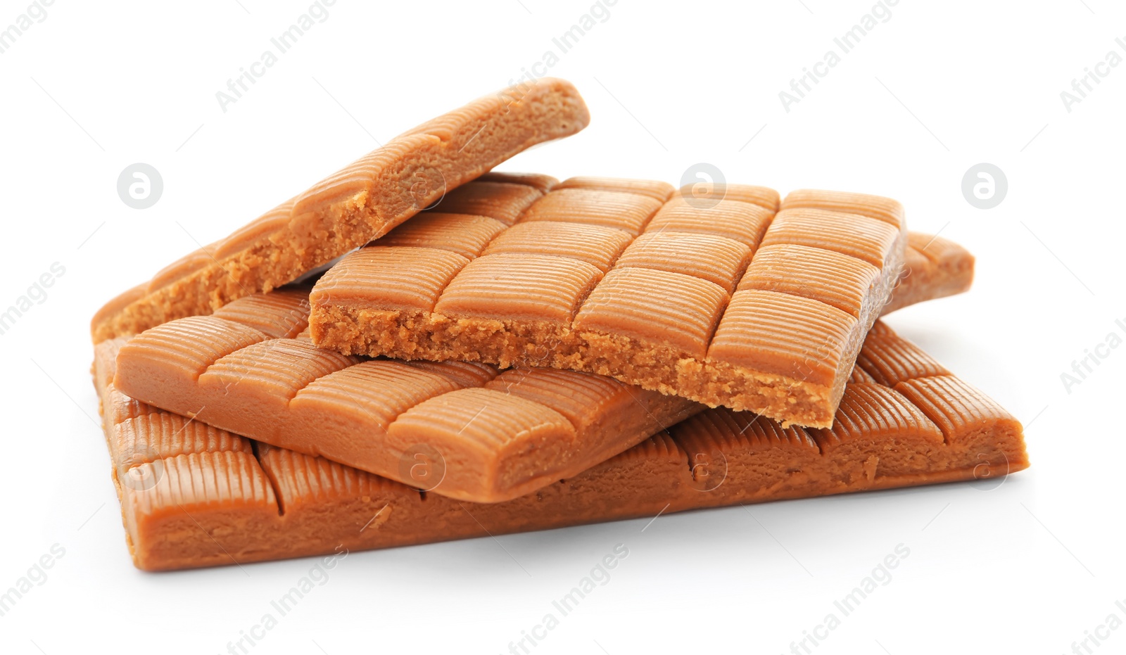 Photo of Delicious caramel candies on white background