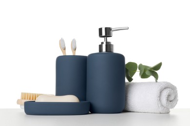 Bath accessories. Different personal care products and eucalyptus branch on table against white background