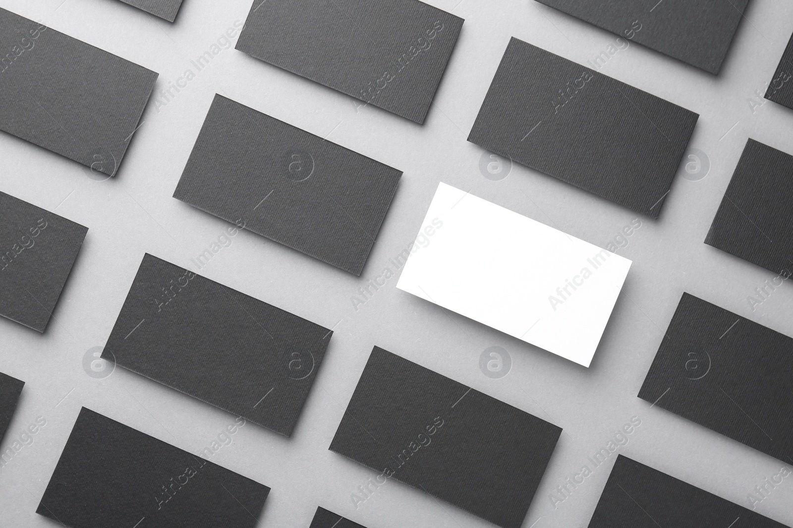 Photo of Blank business cards on light grey background, flat lay. Mockup for design