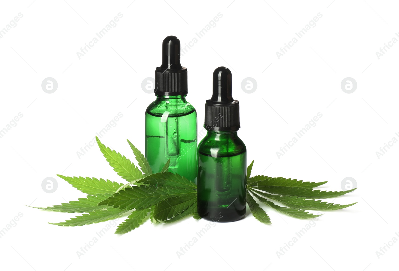 Photo of CBD oil, THC tincture and hemp leaves on white background