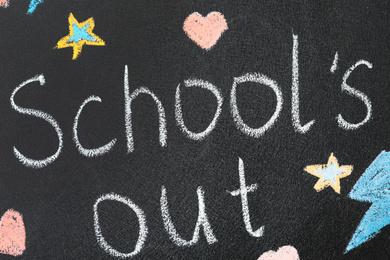 Words School's Out and pictures on blackboard. Summer holidays