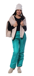 Photo of Woman wearing stylish winter sport clothes on white background