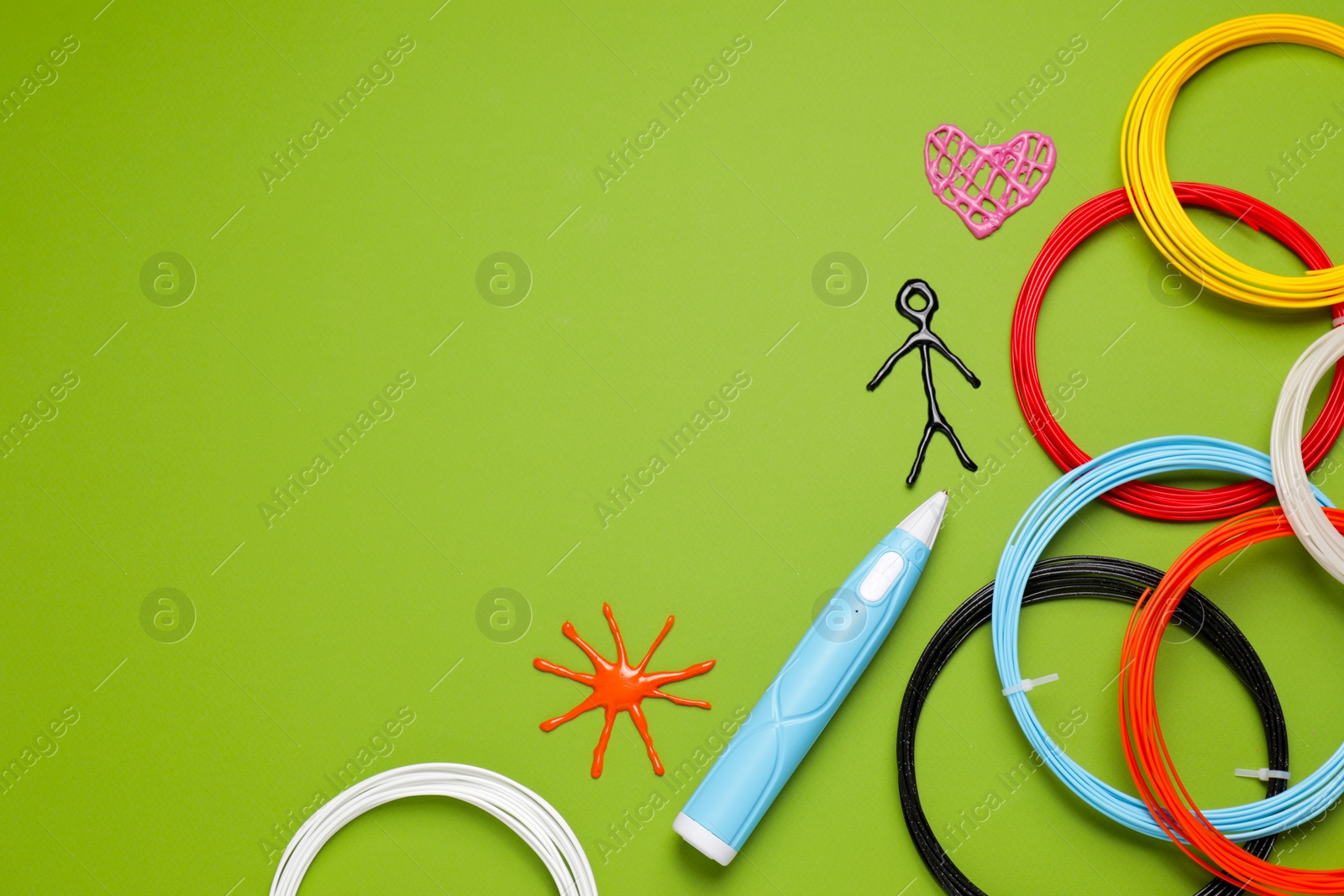 Photo of Stylish 3D pen, colorful plastic filaments and different figures on light green background, flat lay. Space for text