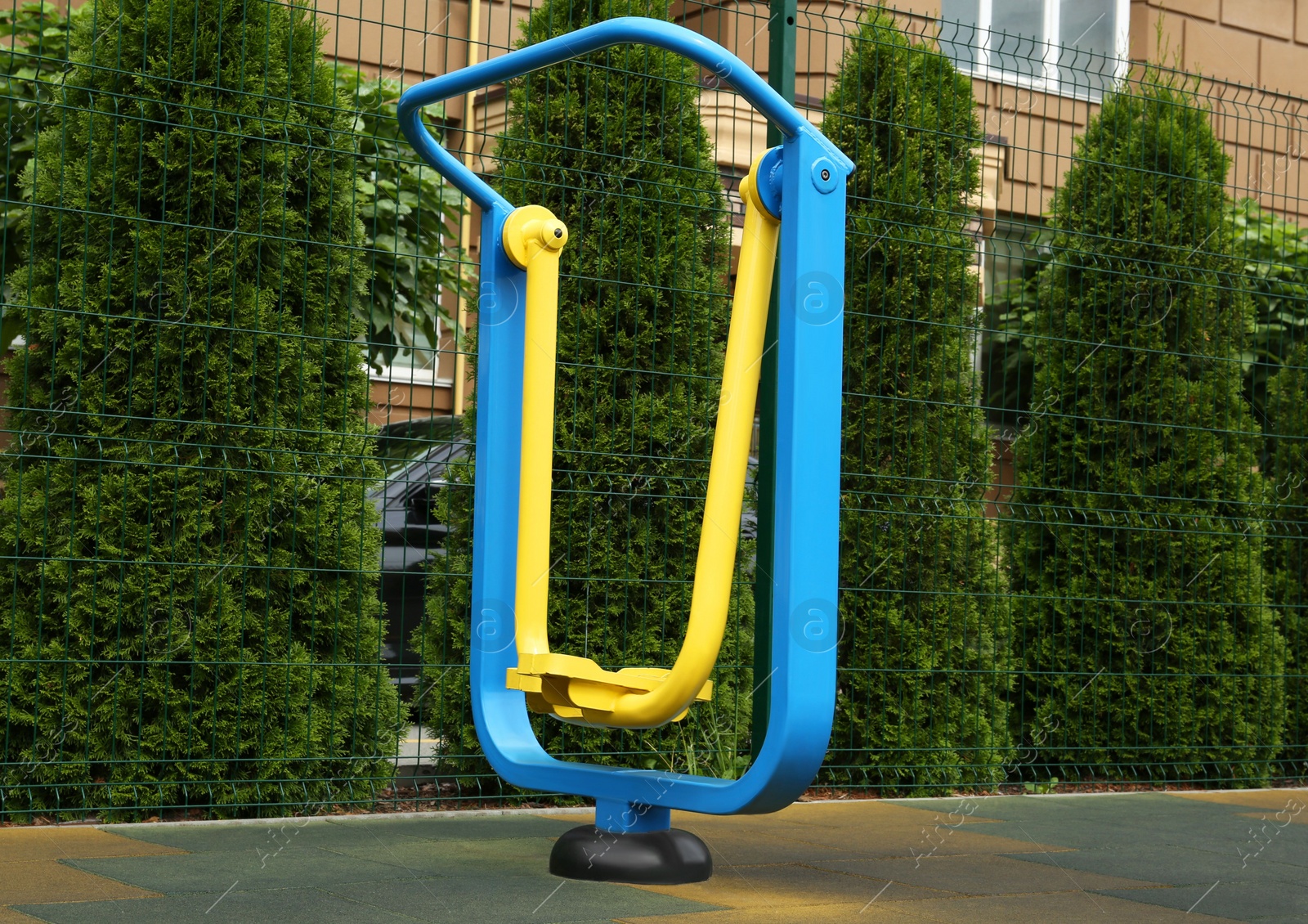 Photo of Empty outdoor playground with air walker in residential area