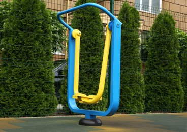 Photo of Empty outdoor playground with air walker in residential area