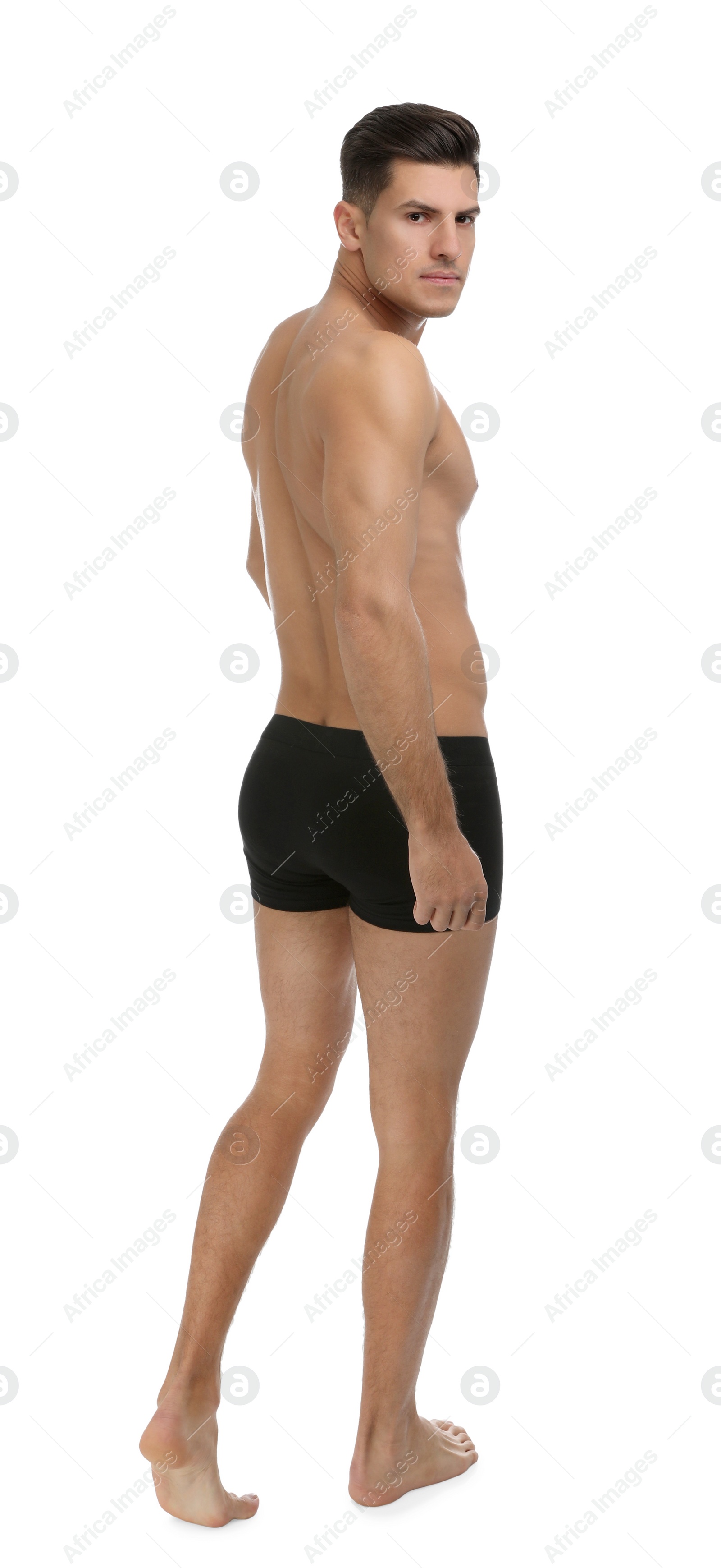 Photo of Handsome man in black underwear on white background