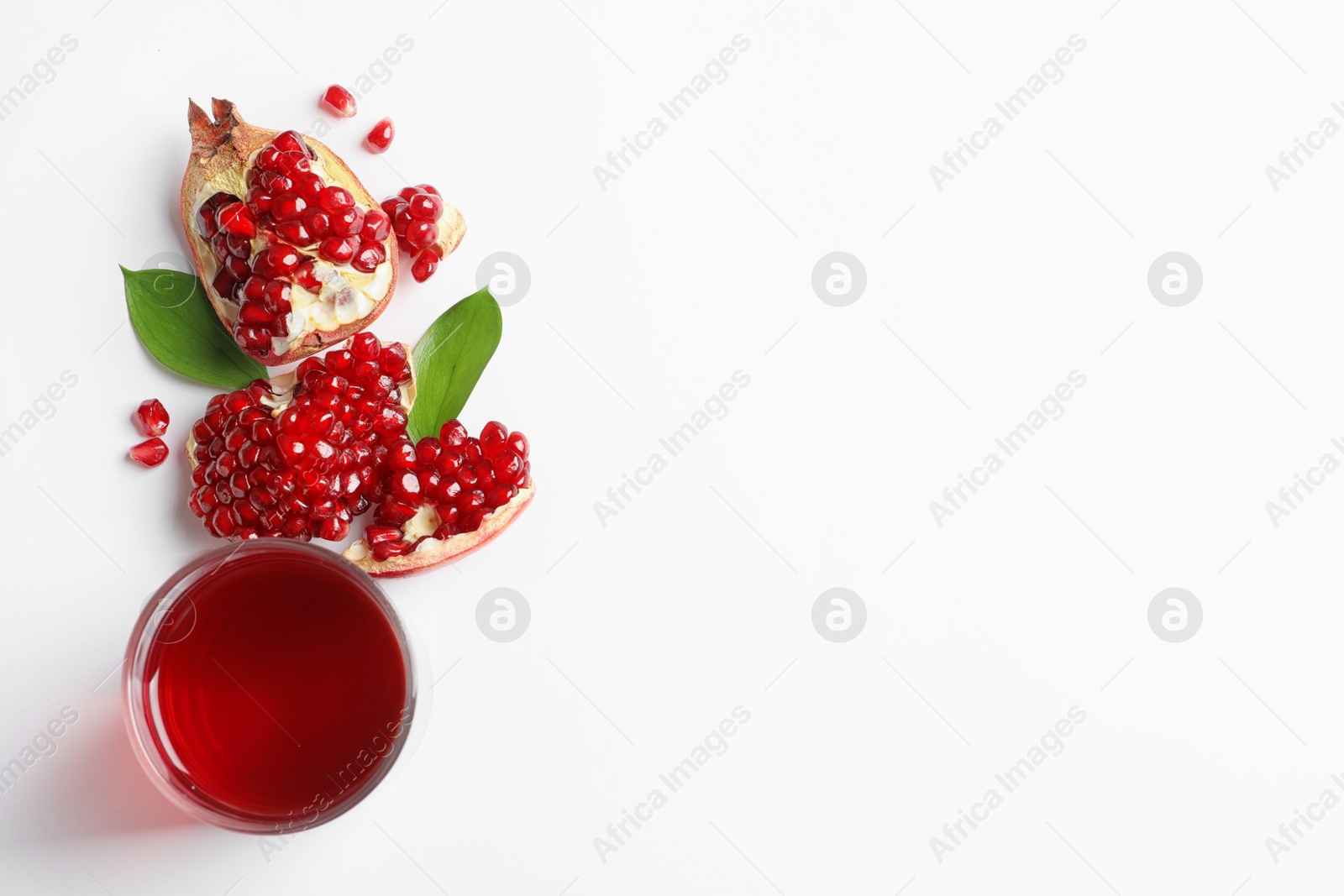 Photo of Glass of pomegranate juice and fresh fruits on white background, top view