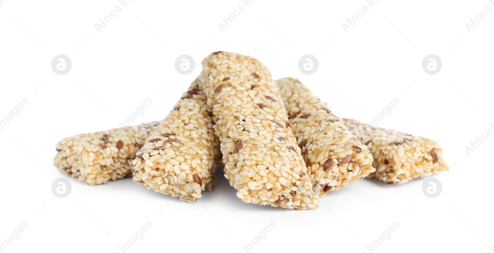 Photo of Tasty sesame seed bars isolated on white