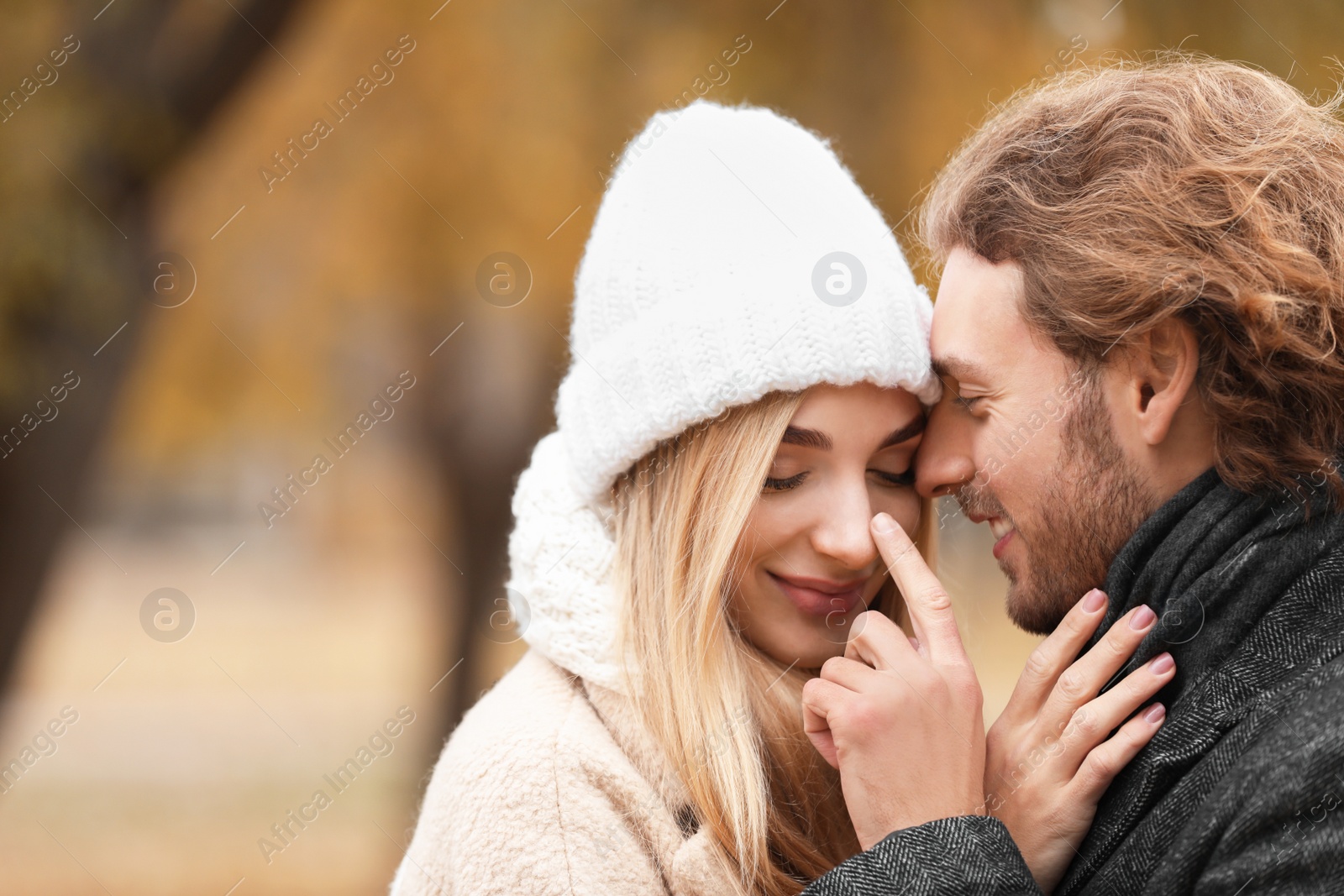 Photo of Young romantic couple in park on autumn day