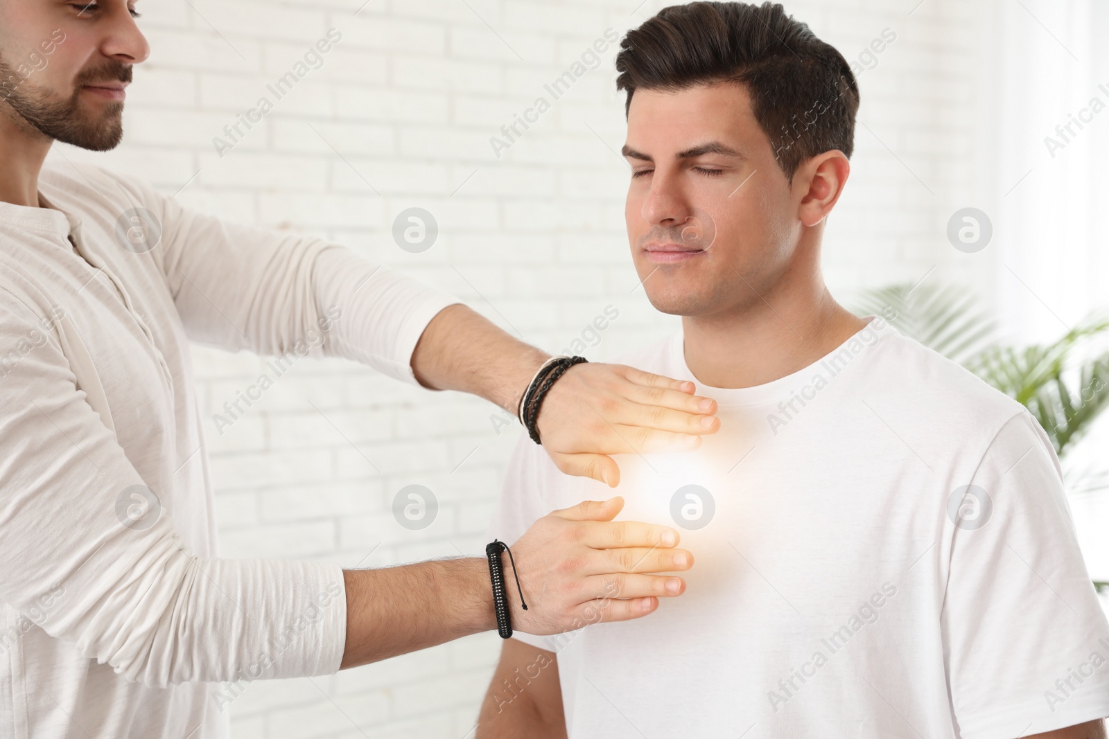 Photo of Man during healing session in therapy room