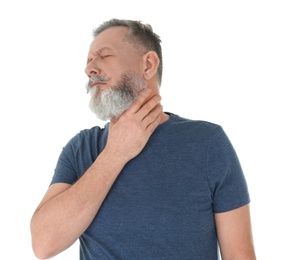 Man suffering from throat pain on white background