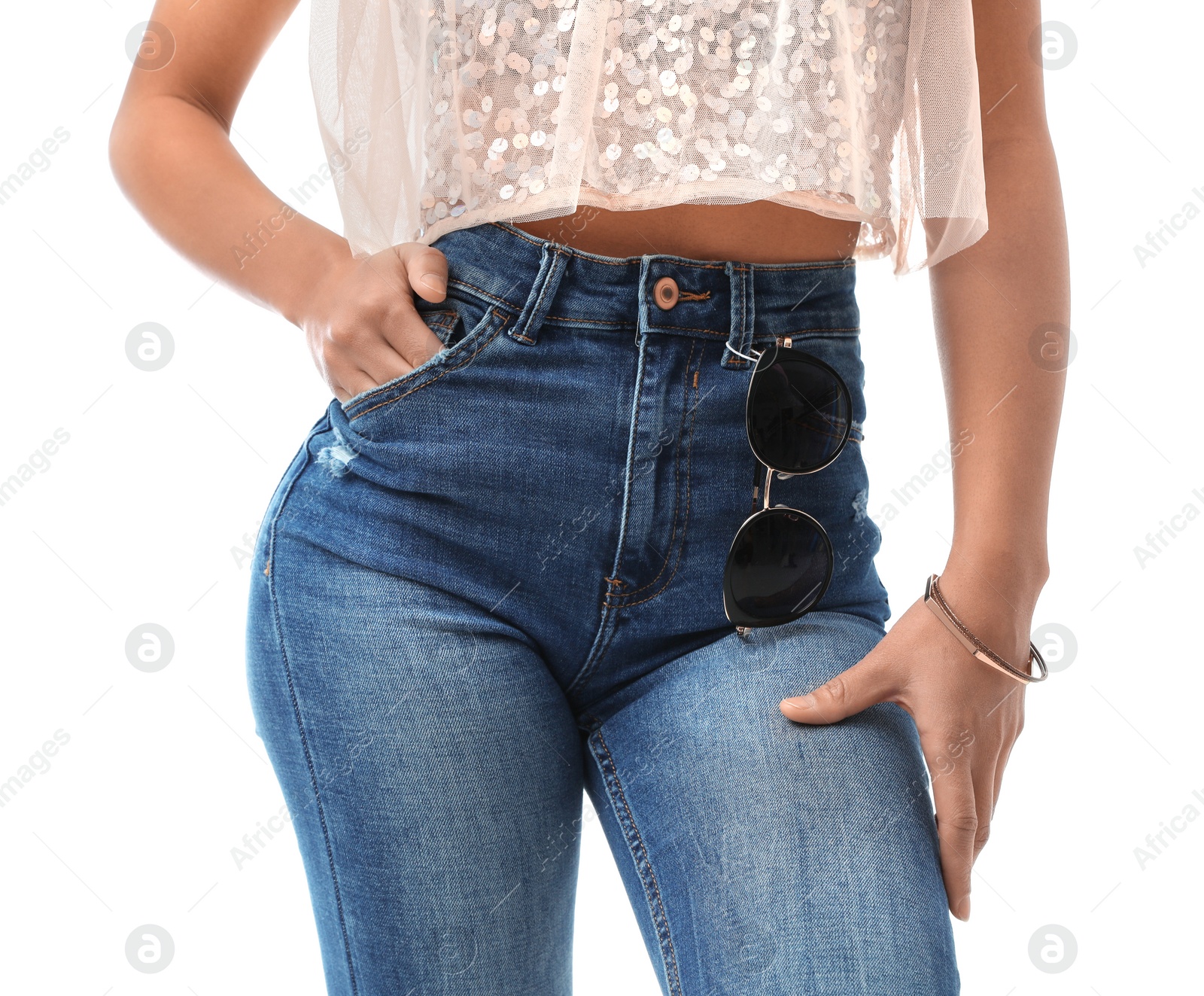 Photo of Woman wearing jeans on white background, closeup