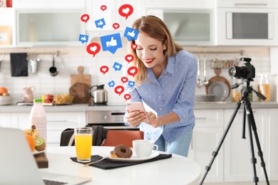 Image of Food blogger taking photo of breakfast in kitchen