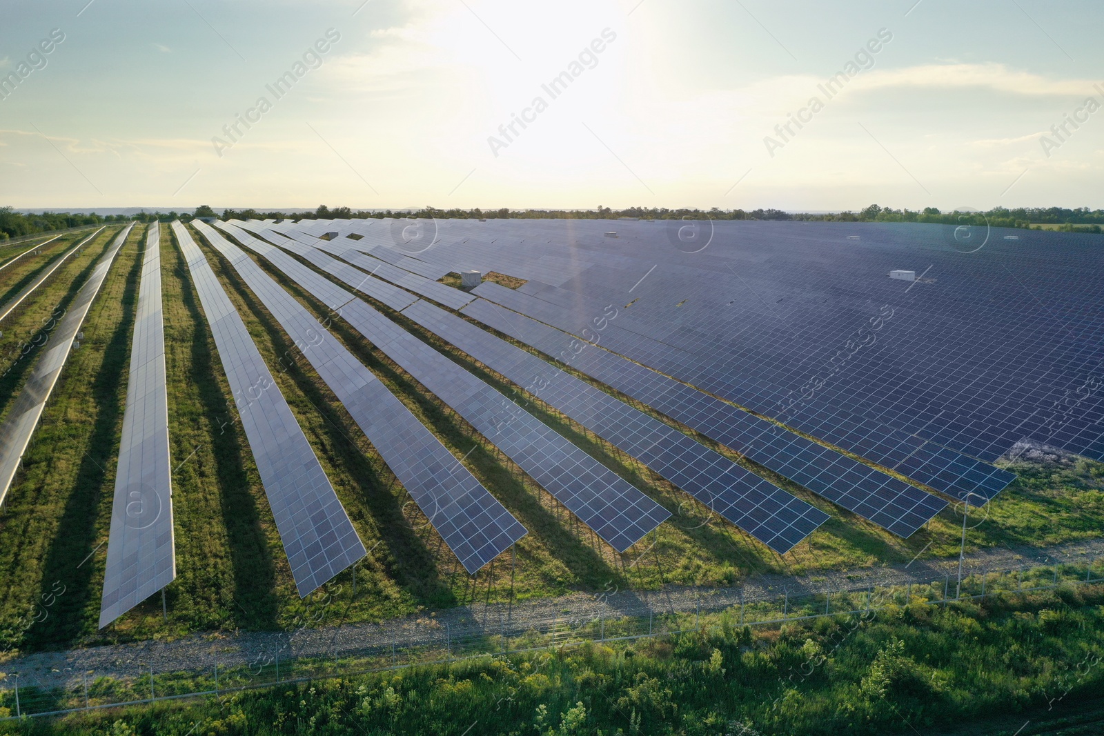 Photo of Solar panels installed outdoors, aerial view. Alternative energy source