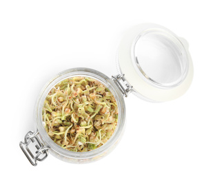 Photo of Glass jar of sprouted green buckwheat isolated on white, top view