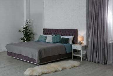 Photo of Contemporary room interior with comfortable double bed