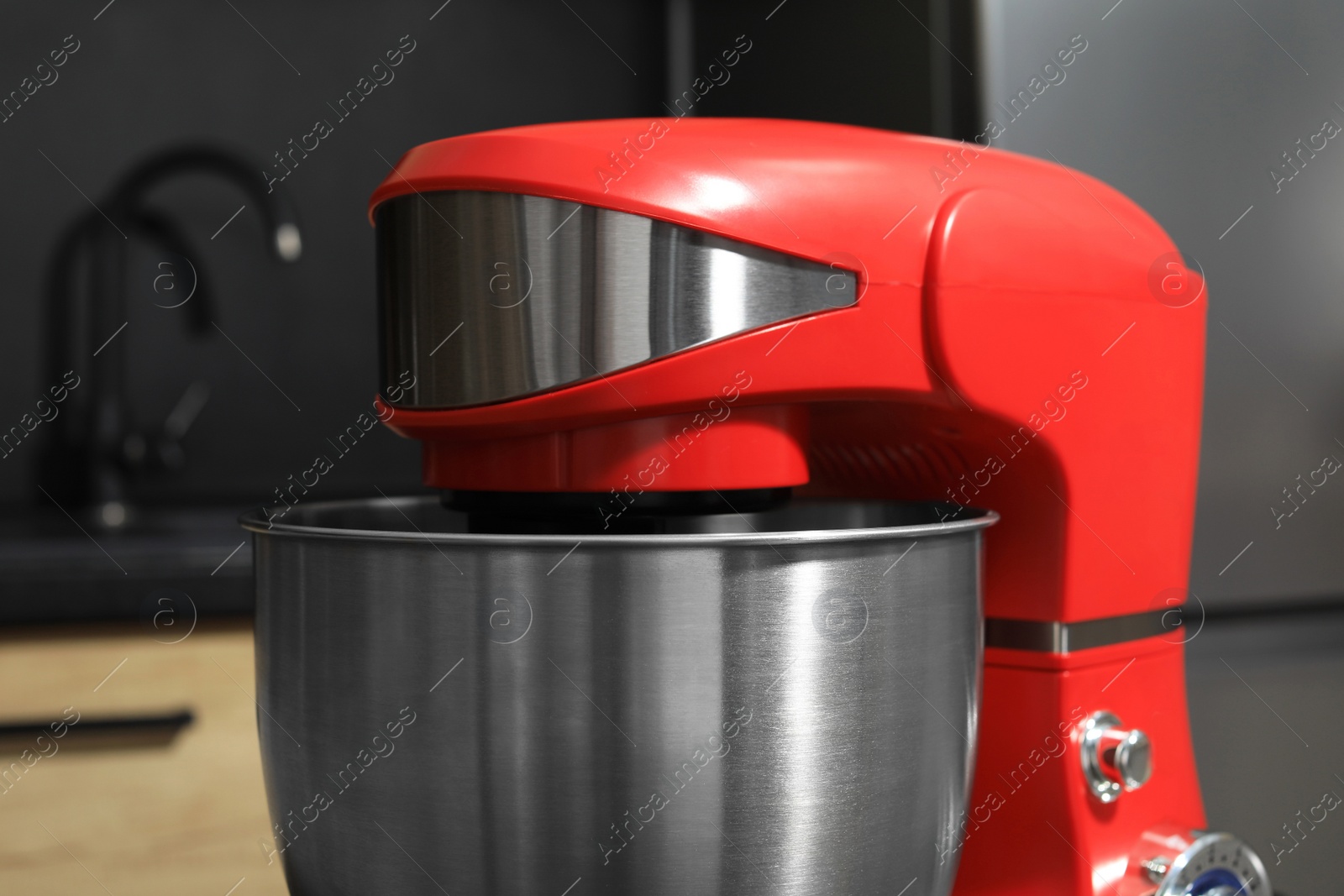 Photo of Modern stand mixer in kitchen, closeup. Home appliance