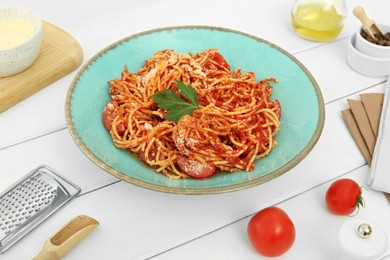 Beautiful composition with spaghetti on white wooden table in studio. Food stylist