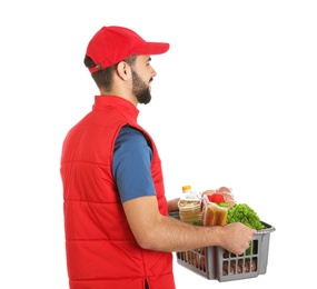 Photo of Man holding basket with fresh products on white background. Food delivery service