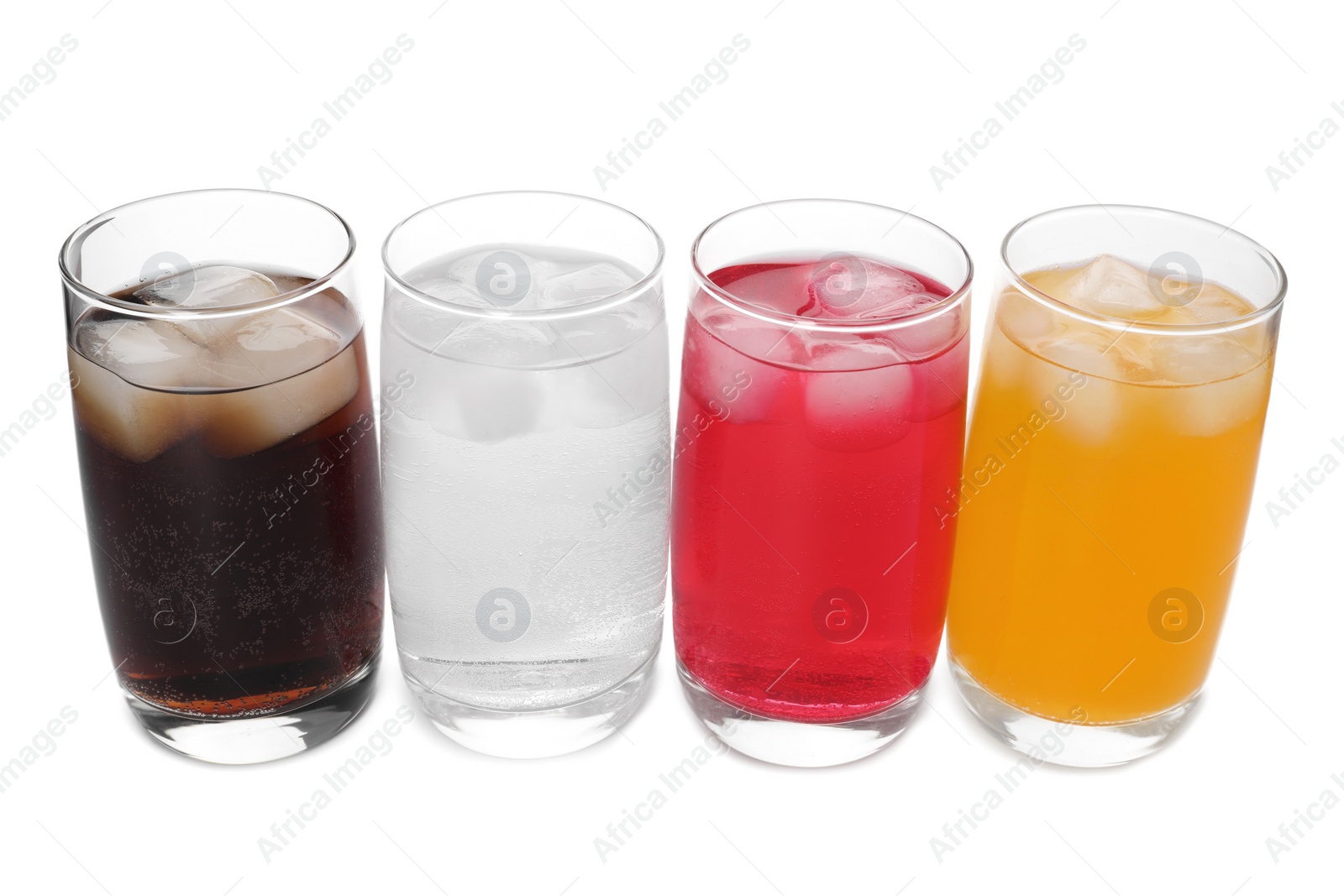 Photo of Glasses of different refreshing soda water with ice cubes on white background