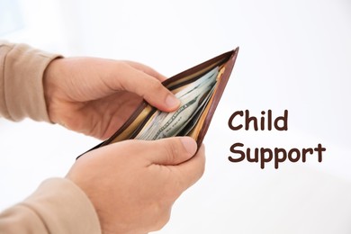 Image of Child support concept. Man holding wallet with money on light background, closeup