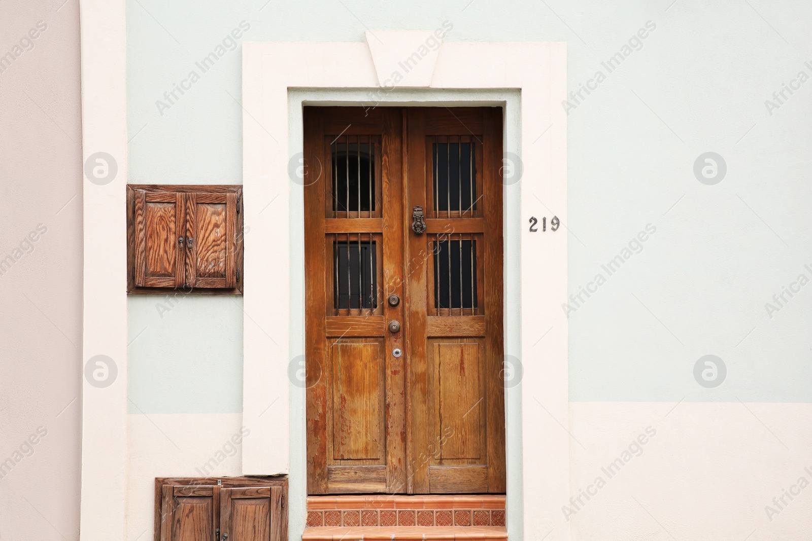 Photo of Entrance of residential house with wooden door