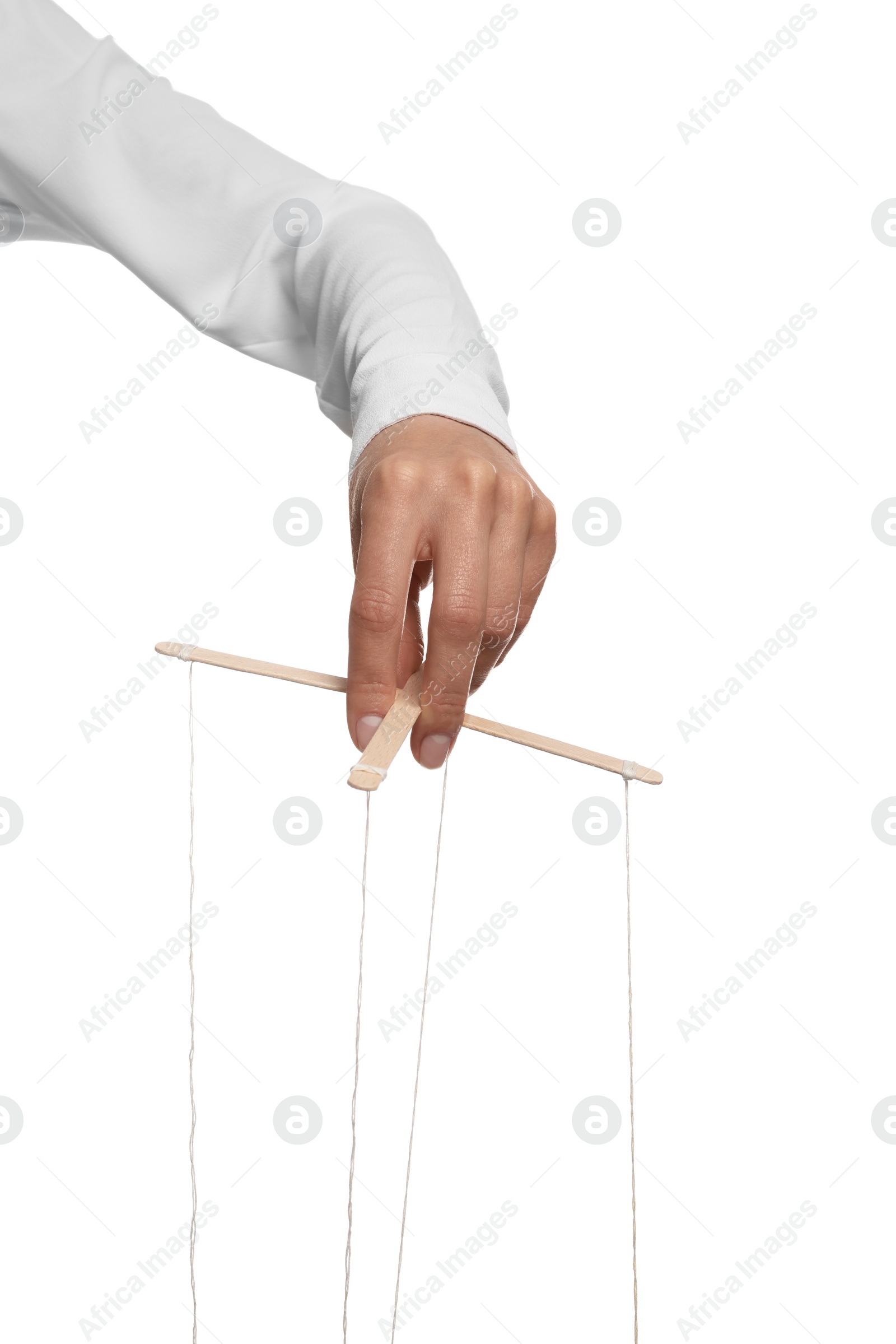 Photo of Woman pulling strings of puppet on white background, closeup