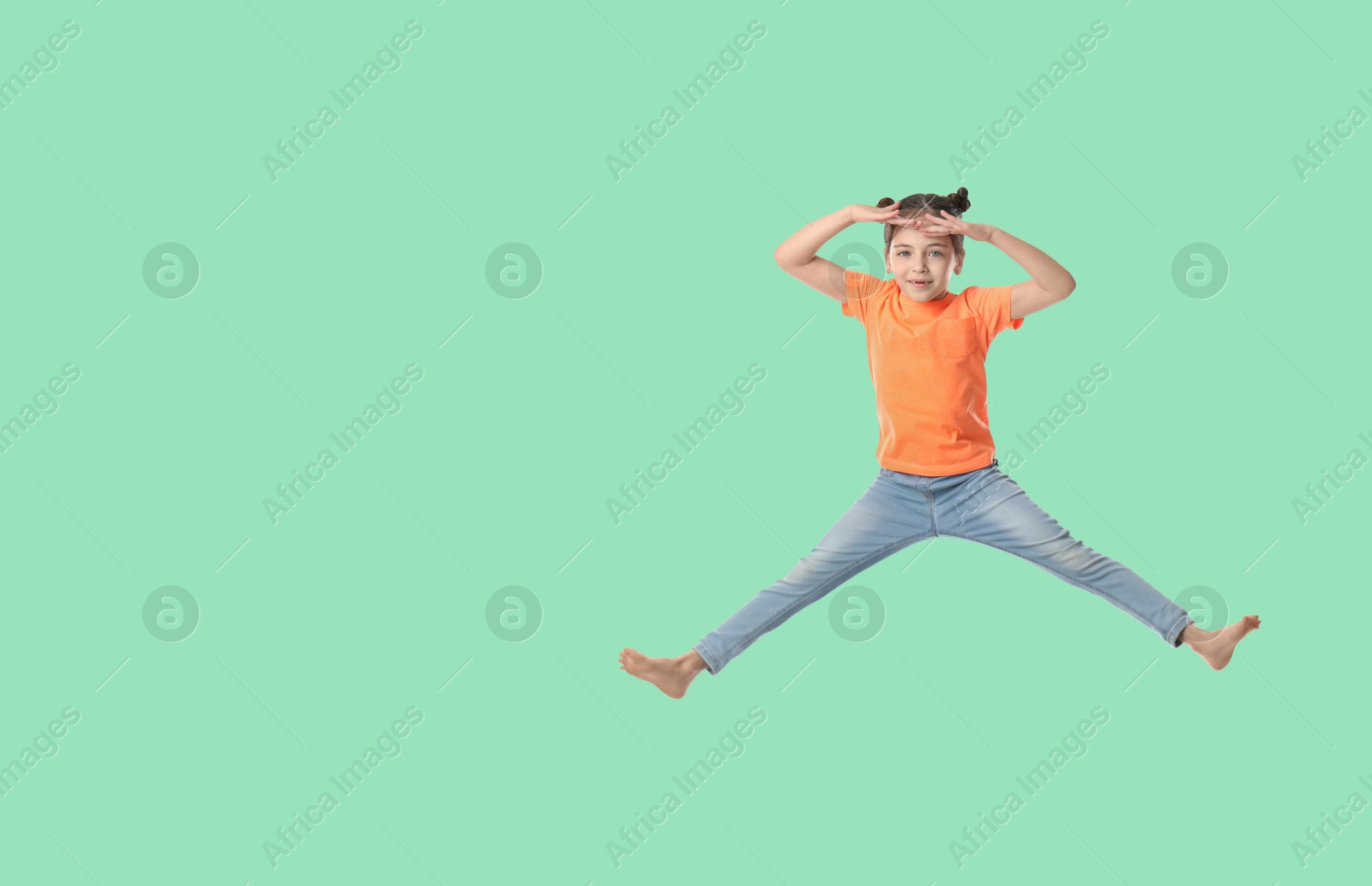 Image of Cute girl jumping on aquamarine background, space for text