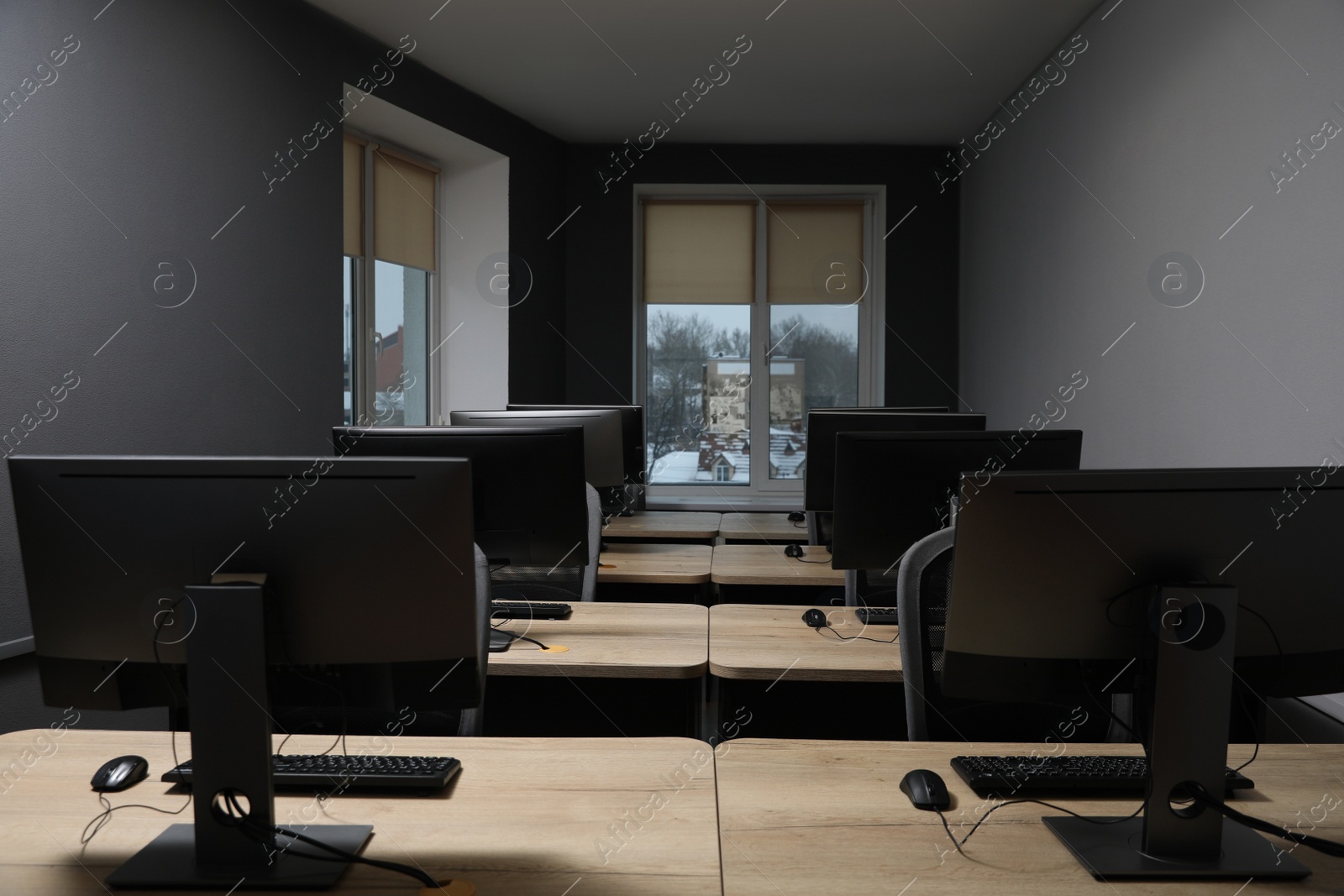 Photo of Many modern computers in open space office