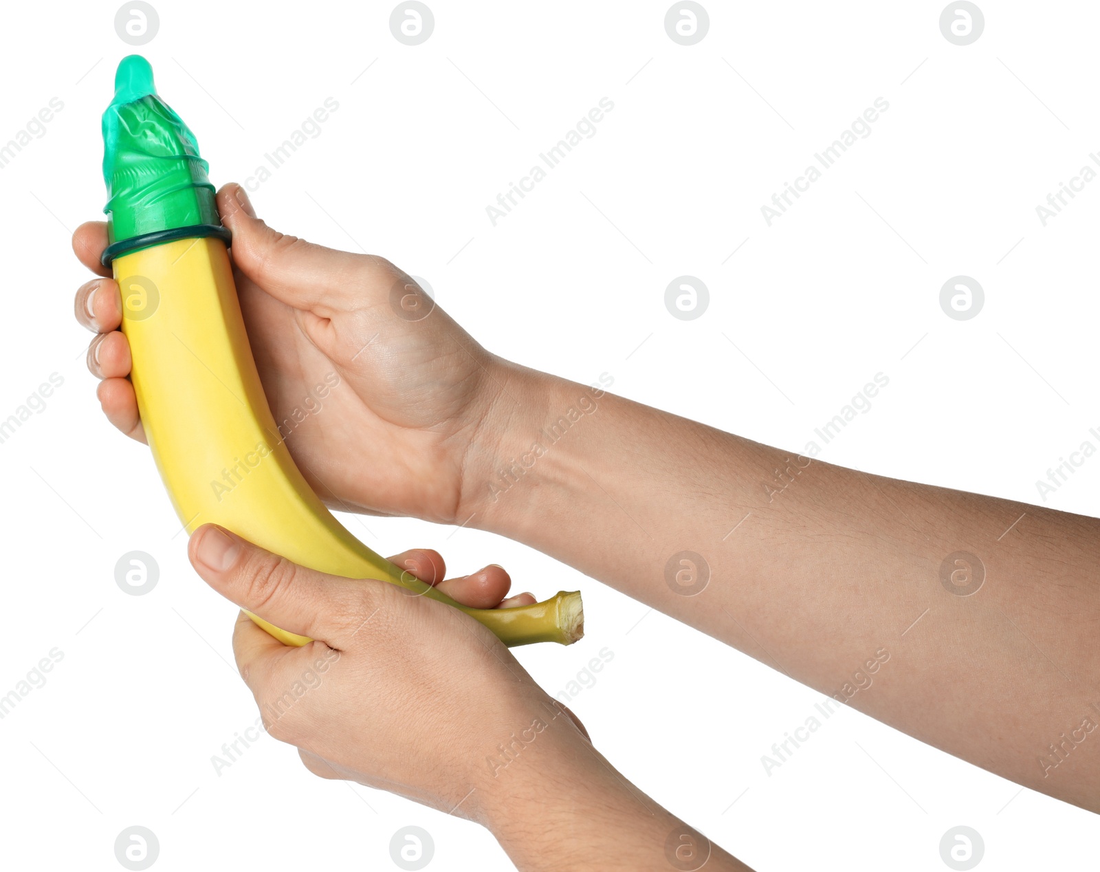 Photo of Woman holding banana in condom on white background, closeup. Safe sex concept