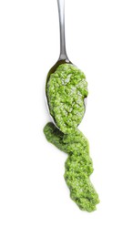 Photo of Sample of tasty pesto sauce and spoon isolated on white, top view