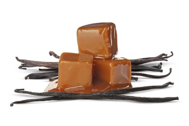 Image of Caramel candies and vanilla pods isolated on white