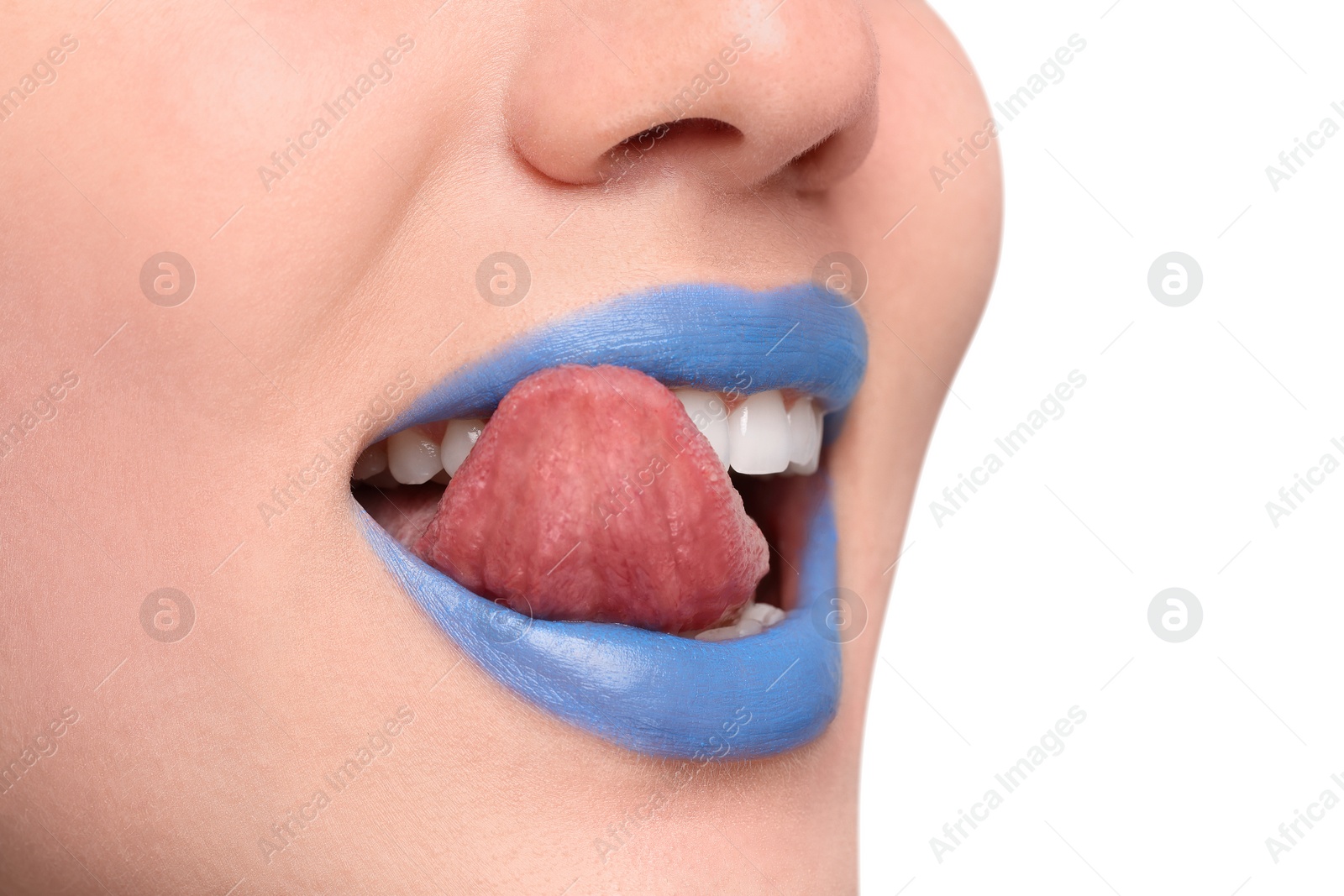 Photo of Woman with blue lipstick showing her tongue on light background, closeup. Space for text