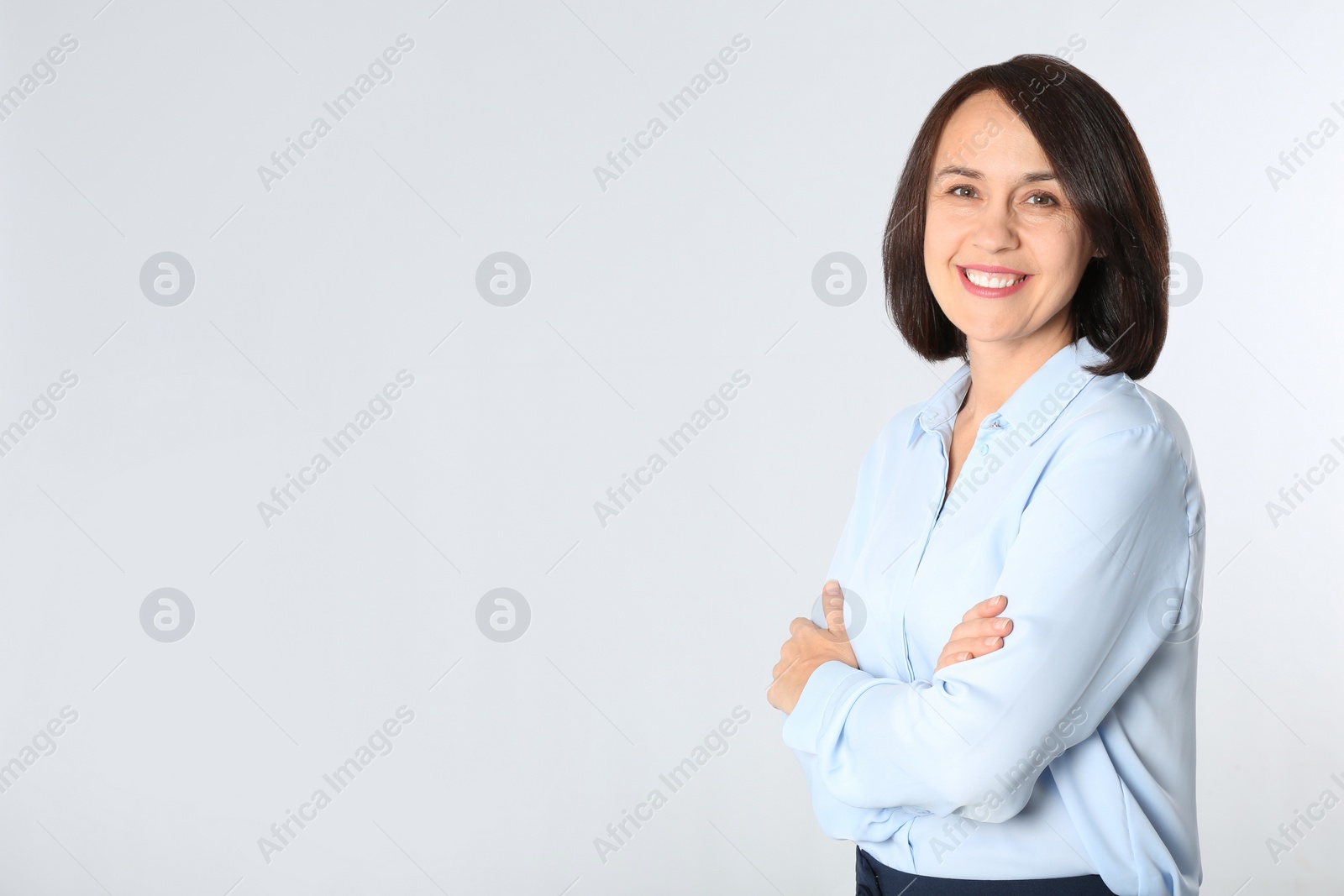 Photo of Portrait of mature businesswoman on white background. Space for text