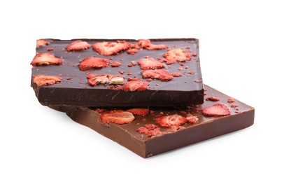 Photo of Halves of chocolate bars with freeze dried strawberries on white background