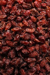 Photo of Dried red barberries as background, closeup view