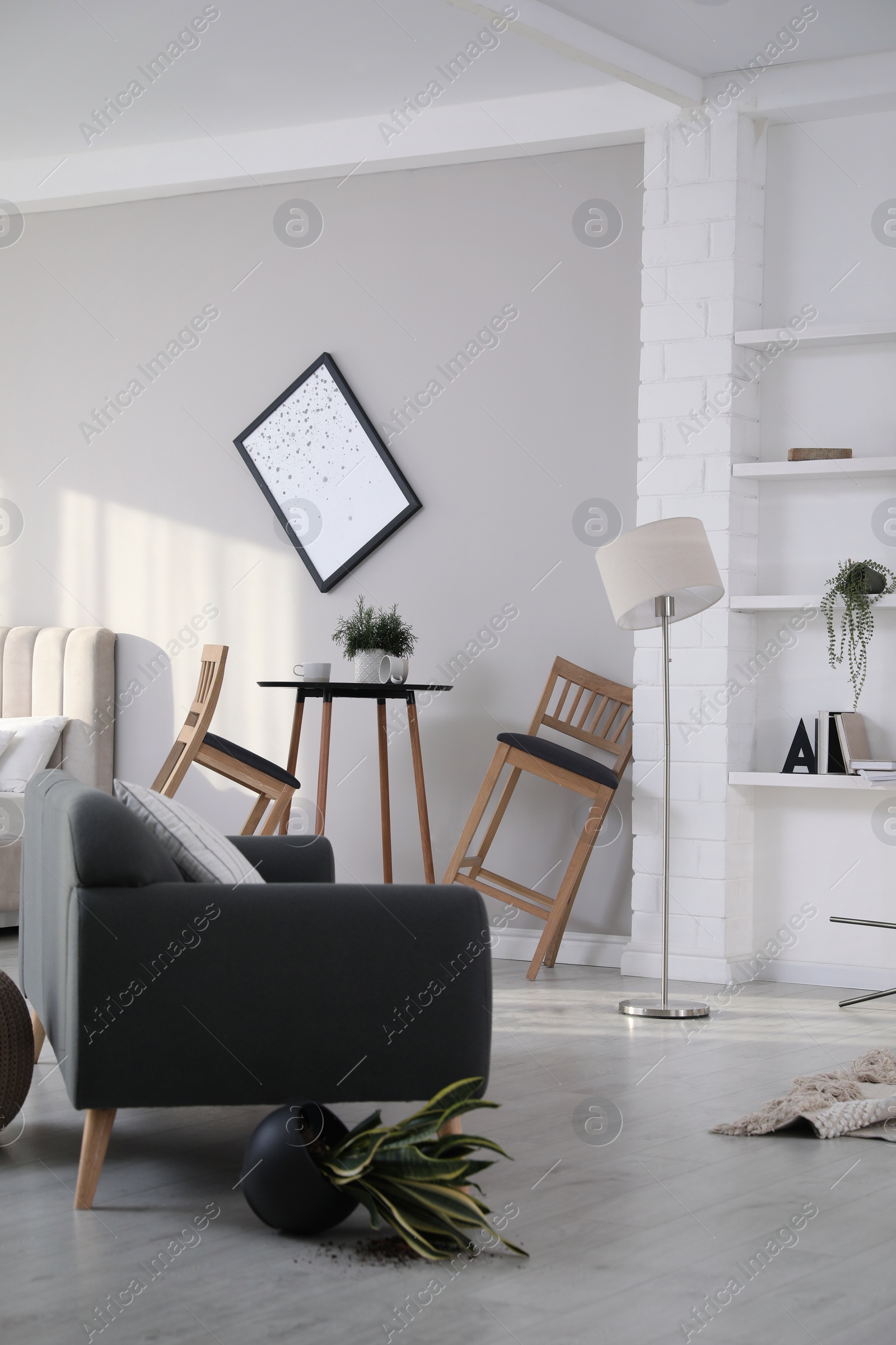 Photo of Chaotic living room interior after strong earthquake