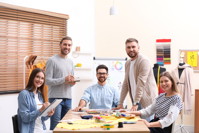 Photo of Fashion designers creating new clothes in studio