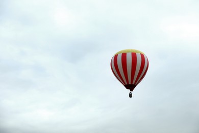 Photo of View of hot air balloon in blue sky, space for text