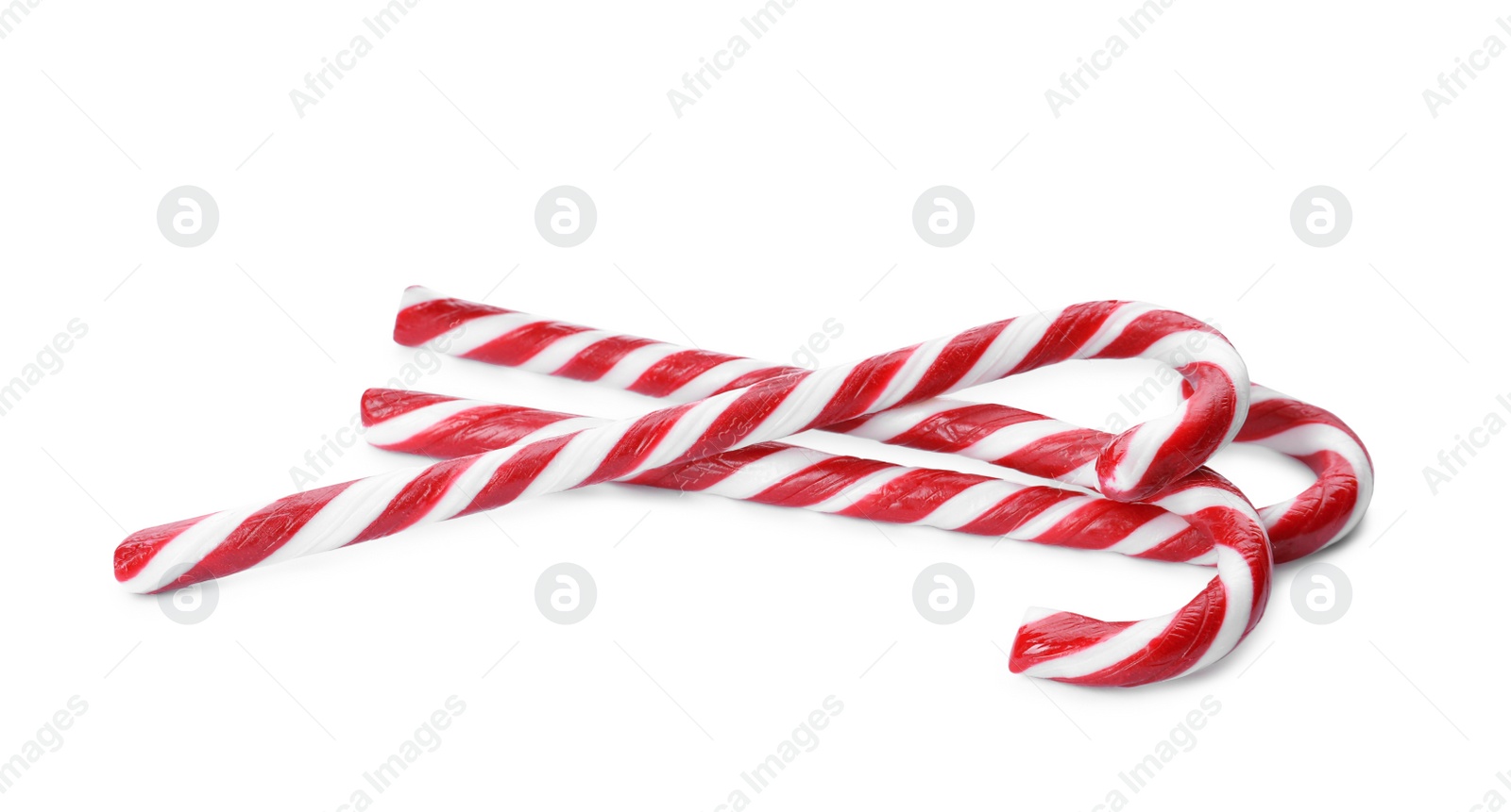 Photo of Delicious Christmas candy canes on white background