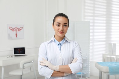 Photo of Portrait of beautiful young gynecologist in clinic