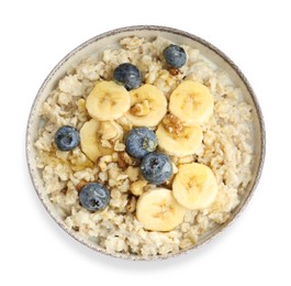Tasty oatmeal with banana, blueberries, milk and walnuts in bowl isolated on white, top view