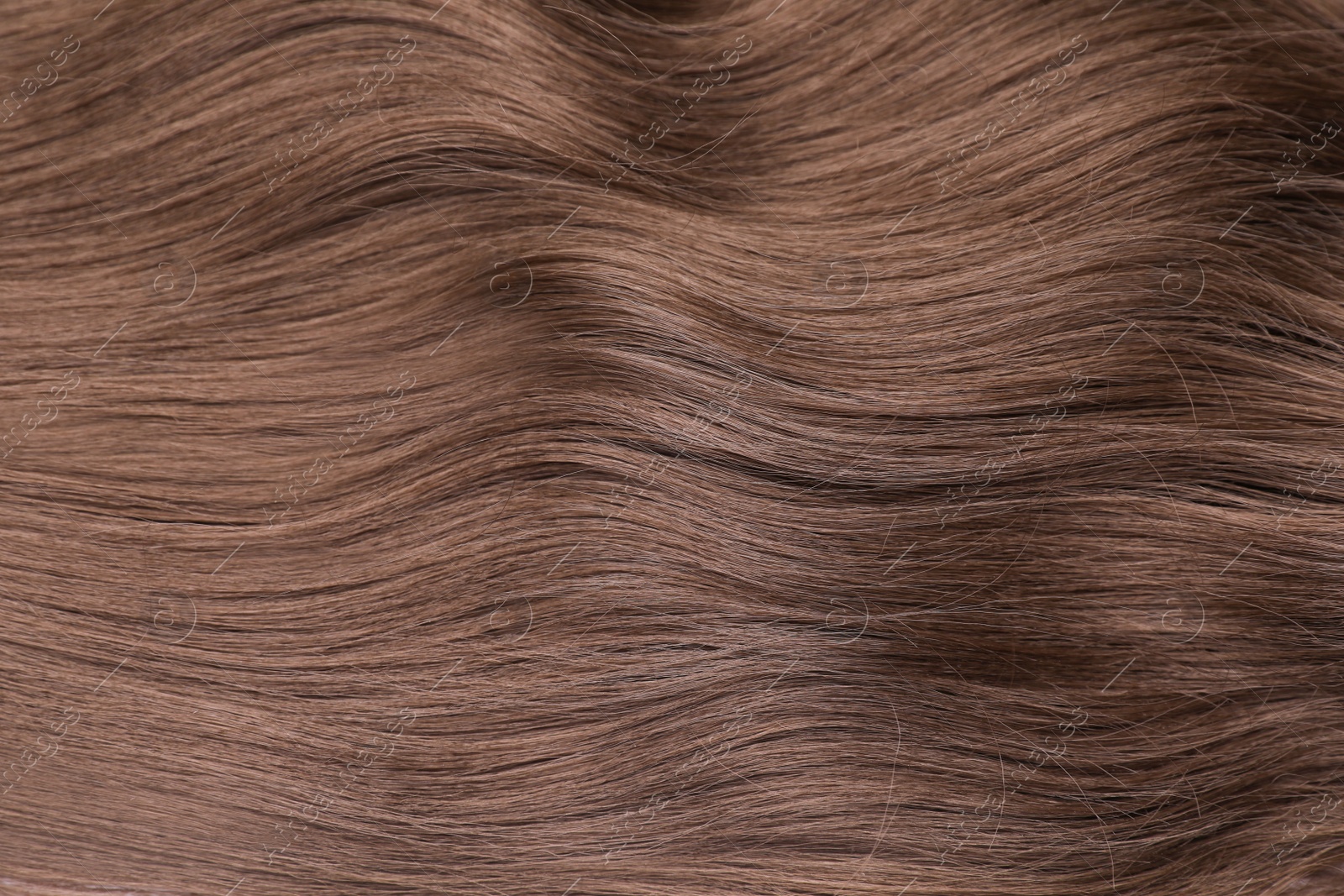 Photo of Beautiful brown hair as background, top view