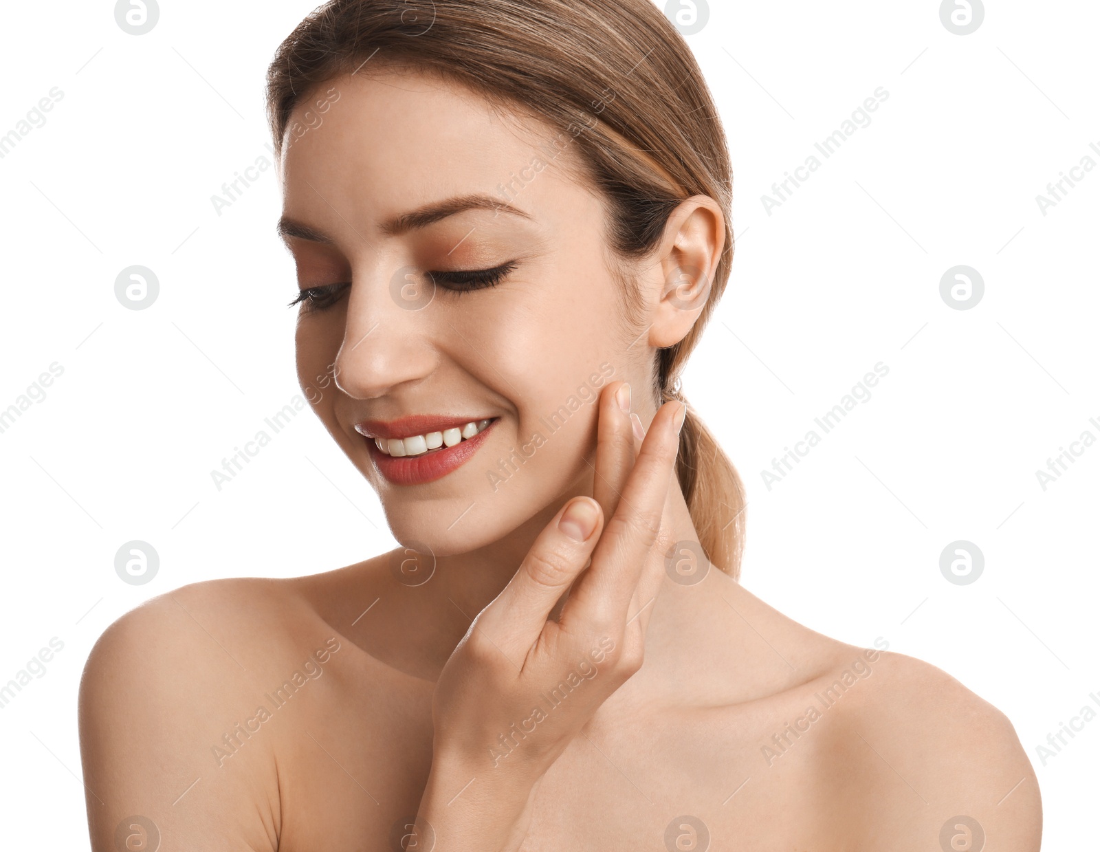 Photo of Young woman applying facial cream on white background