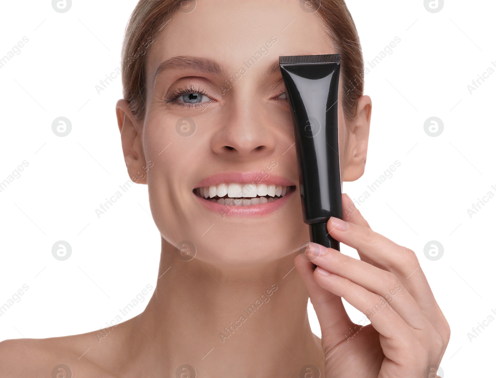 Photo of Woman holding tube with foundation on white background